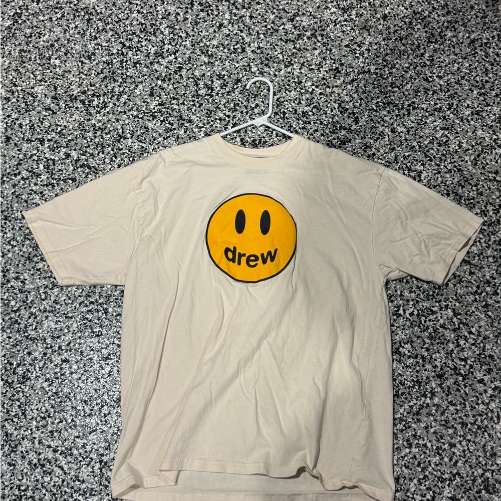 drew house cream tee with yellow logo label